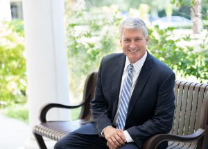 head of school sitting on bench, private school, tampa fla