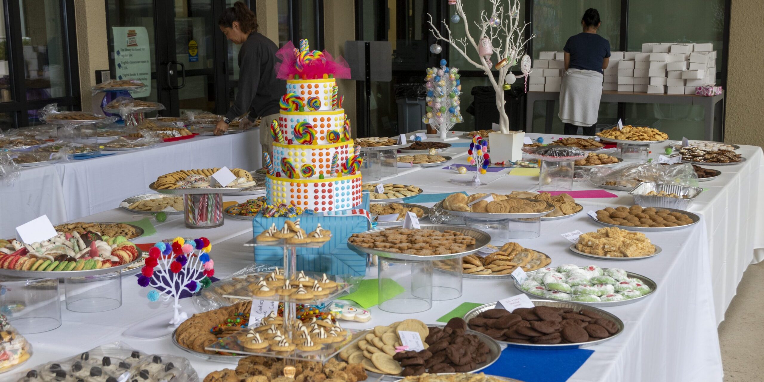 A photo of a table full of cookie platters.